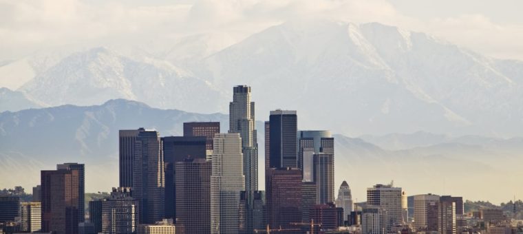 Los Angeles skyline during the day with mountains in the background
