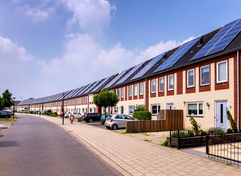 Row of houses, each with a solar panel on the roof