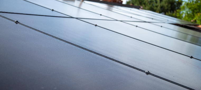 Close up of solar panels covering the roof a single family home.