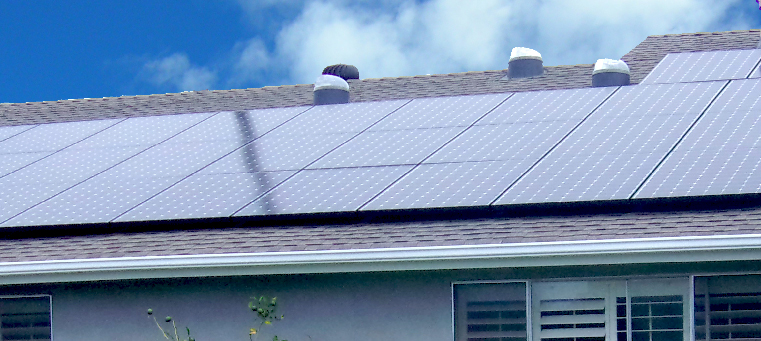 Solar panels covering entire asphalt-shingle roof.