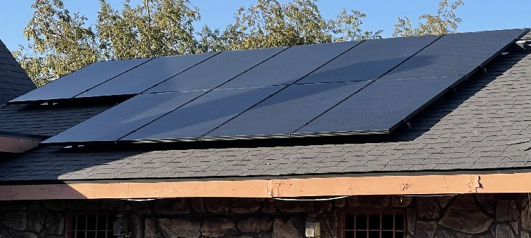 Ten solar panels on asphalt-shingle roof single-family home.