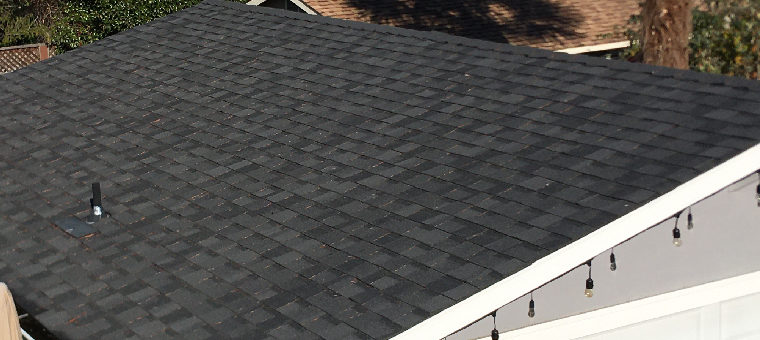 Dark asphalt shingle roof without solar panels.