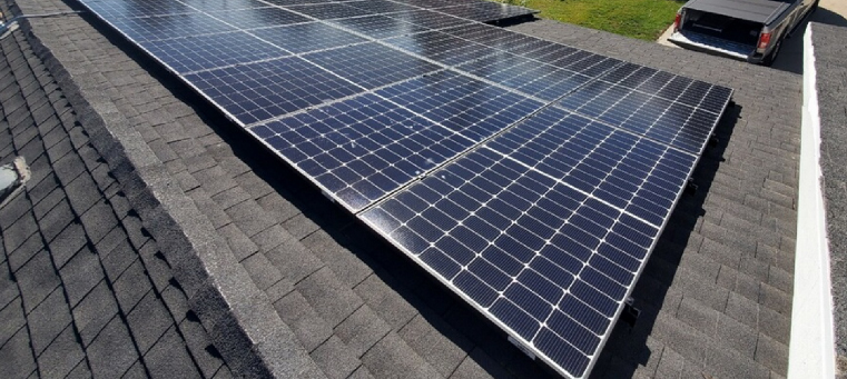 Solar panels installed on single story home with asphalt shingles.