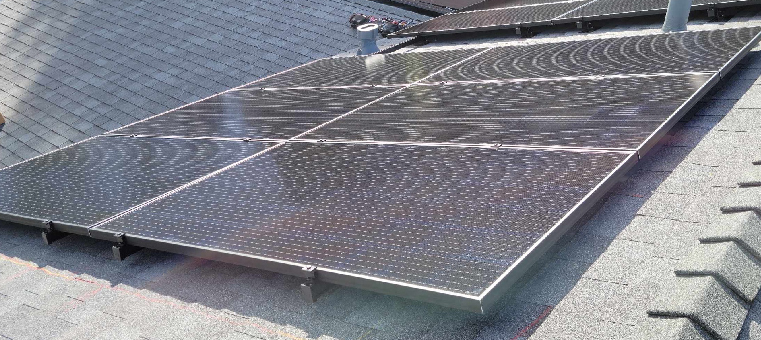Six solar panels on asphalt shingle roof.