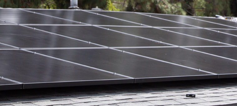 Solar panels on asphalt shingle roof.