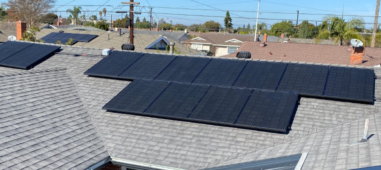Solar panels on roof of single family home.