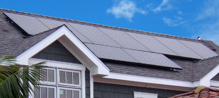 Nine solar panels on single-family home with a shingle roof.