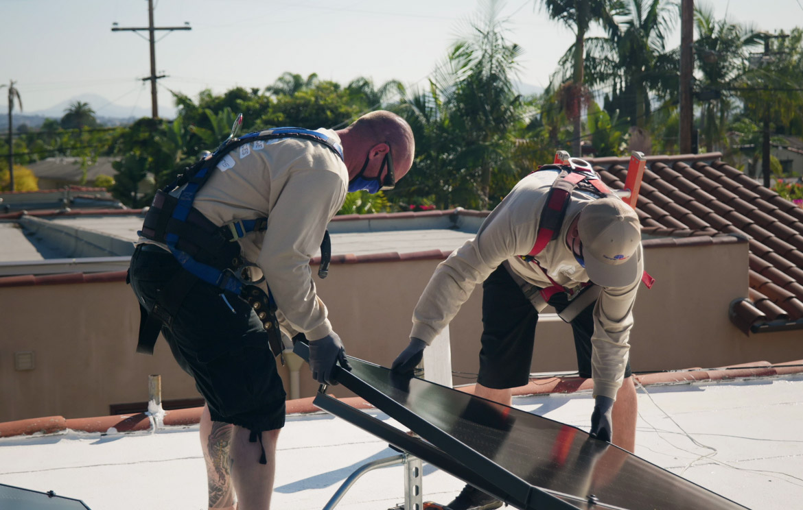 Solar Installers Placing a Solar Panel